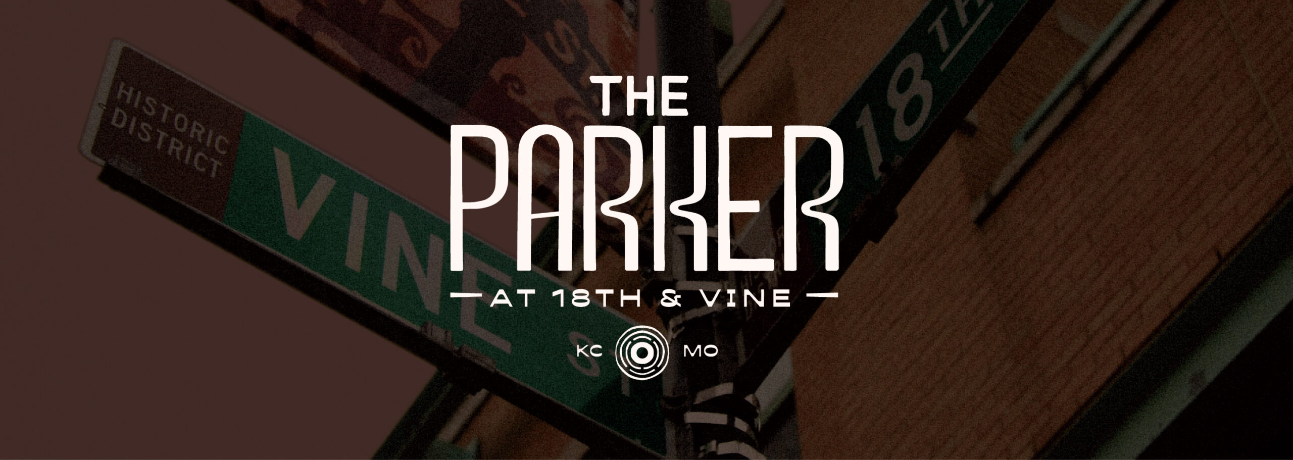 Logo for The Parker overlayed on image of 18th and Vine street sign